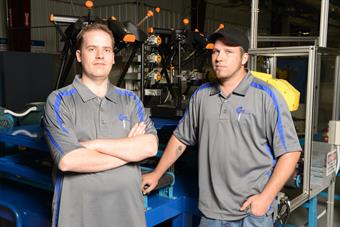 CNC programmer James Wardell and robotics technician Jeff Buck of Conroe Machine