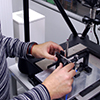 Eponsa case story - An Eponsa engineer loads a wiper mechanism part onto Equator ready for gauging