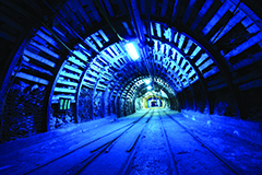 Underground mine with tracks and lighting