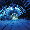 Underground mine with tracks and lighting
