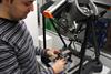 Eponsa case story - An Eponsa engineer loads a wiper mechanism part onto Equator ready for gauging