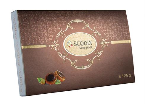 Scodix chocolate box example - the label text has been printed in relief inside an embossed gold background pattern