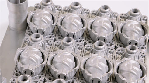 Tray of 3D printed hydraulic parts from Domin