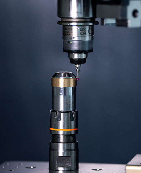 Close up of RMP24-micro probe measuring a ring part on a fixture in OMBI's OM200 ultra-compact 5-axis machine