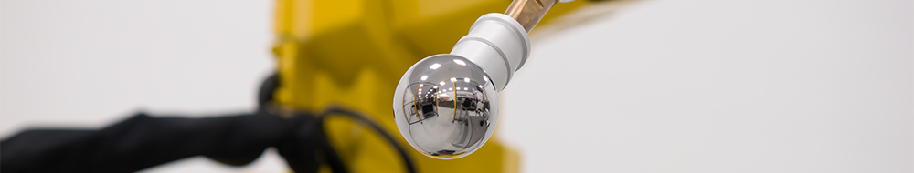 RCS hollow ball threaded accessory kit attached to the end of a weld torch that is fixed to a Kuka six-axis robot