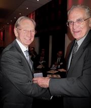 Sir David McMurtry (L) receives the Callendar Medal from Lord Oxburgh at a ceremony in October