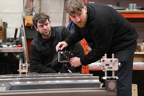 Engineer demonstrating how to set up XK10 alignment laser system