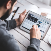 Man reads news on tablet