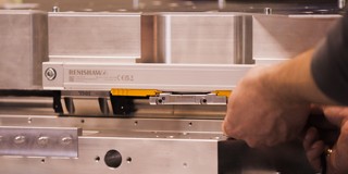 FORTiS enclosed encoder being installed on micro-milling machine