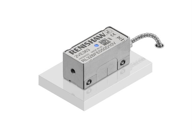 RESOLUTE™ UHV optical encoder on a white platform