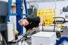 Applications engineer at MTT checking equipment