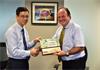 Mr Loh Yew Chiong, Singapore Polytechnic (left) and Mr Steve Bell, Renishaw ASEAN (right) exchanging gifts