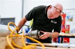 Engineer at MTT checking equipment