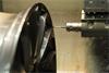 SAI - OLP40 performing in-process control of wheel production modelling.