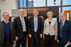 Prime Minister Theresa May and Chancellor of the Exchequer Philip Hammond in front of a Renishaw metal additive manufacturing (3D printing) system