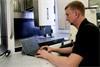 Engineer using CARTO software suite with XM-60 multi-axis calibrator