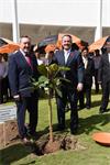 Secretary of State Liam Fox (right) plants commemorative tree with Renishaw's Rhydian Pountney