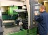 Operator using Mazak FJV250 controller