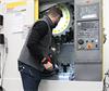 USA training engineer setting up a QC20 ballbar in a machine