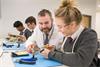 Students and a teacher from Radyr School during a design and technology lesson at the Renishaw Fabrication Development Centre