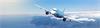 Aeroplane flying over coast, symbolising sustainable aerospace manufacturing