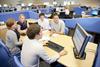 Software graduates team meeting with computer screen