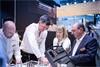 Employees with styli and fixturing products on Control stand 2025