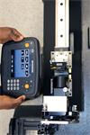 Engineer using XK10 alignment laser and display unit