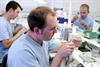 Three lab technician finishing copings
