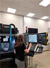 Esmee Howard, Mechnical Engineering Apprentice, drawing the Renishaw emblem on a cnc