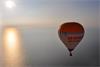 Renishaw hot air balloon surrounded by sea (image courtesy of Exclusive Ballooning)